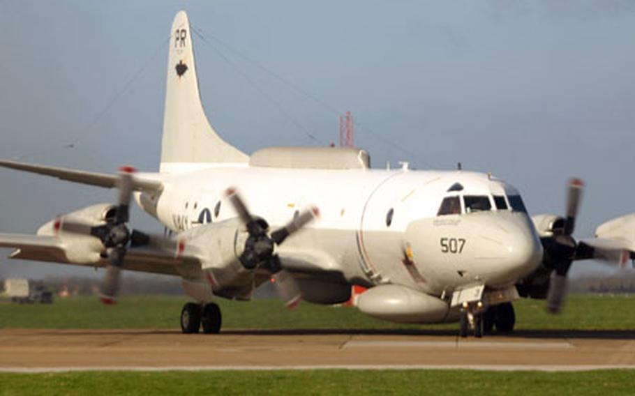 A Navy P3-C Orion aircraft makes its way down the RAF Mildenhall runway after refueling on the base Feb. 28.