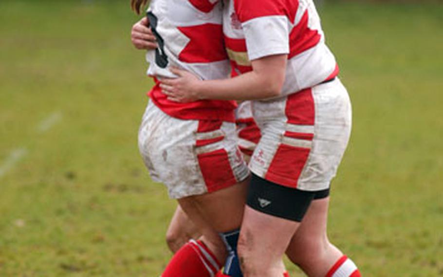 Thetford Ladies Rugby Club players Donna Lawerence, right, and Amanda Walker hug each other after Lawerence scored against West Norfolk last week in Thetford.