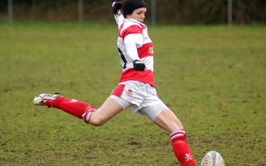 Thetford Ladies Rugby Club player Melanie Paddington kicks for a "conversion" -- extra points, in rugby -- during a recent test against West Norfolk.