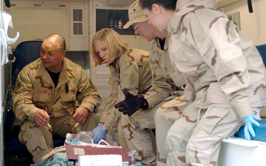 From left, Air Force Staff Sgt. Hans Schjang, Capt. Brandy Casteel, Tech. Sgt. Daniel Fischer and Senior Airman Claudia Rodke, all assigned to Task Force Med, transport a patient from the old Bagram hospital to the new Craig Joint Theater Hospital on Sunday. Medical personnel moved 23 patients to the new facility.