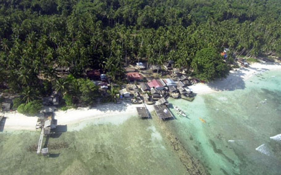 A fishing village is shown from above Jolo Island, Philippines. U.S. and Philippine officials say fighting an insurgency in the island&#39;s heavy jungles - and in other areas in the southern Philippines - is a long, tough task. Many insurgents have friends and family -- and often support -- in villages near where they operate.