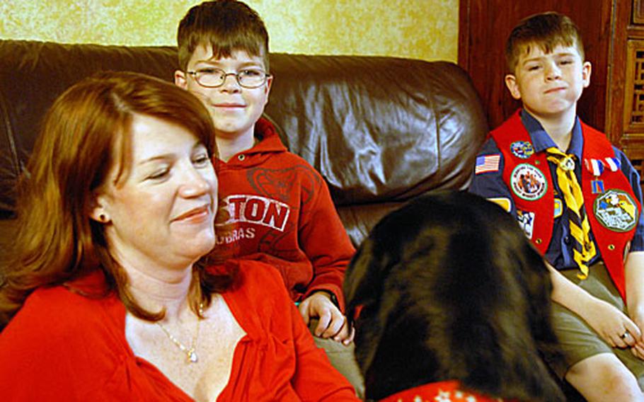 Amy Hittle and her two sons, Eric, left, and Alex, and the family dog, Daisy, are eagerly awaiting the return of Maj. Patrick Hittle, who has been deployed with 9th Engineer Support Battalion since August. The battalion executive officer gets back in about two weeks.