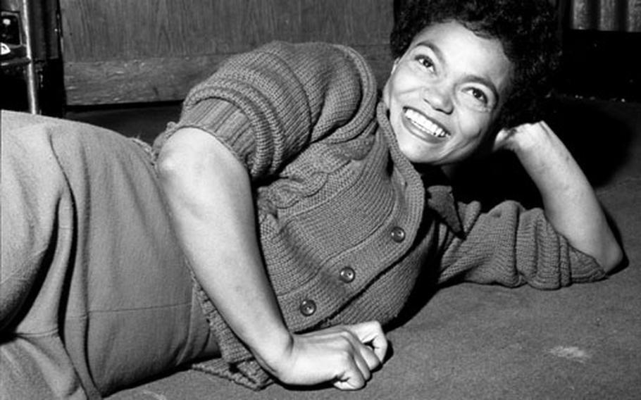 Eartha Kitt relaxes backstage in London in 1958.