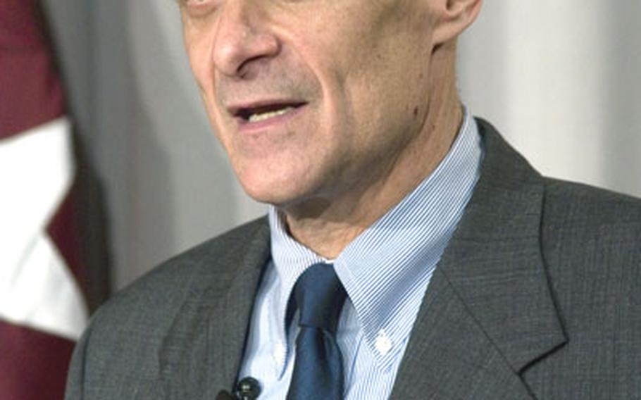 Secretary of Homeland Security Michael Chertoff speaks at Monday&#39;s naturalization ceremony. Chertoff administered the oath of citizenship to four foreign-born U.S. servicemembers.