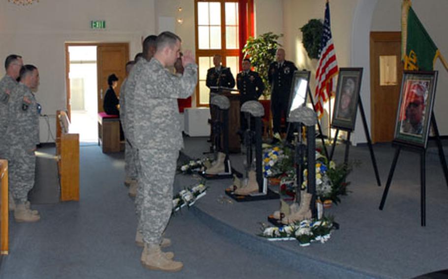 Members of the Bamberg, Germany, military community pay their respects to three fallen sergeants during a memorial ceremony for three fallen military policemen at the Bamberg, Germany, community chapel Tuesday.