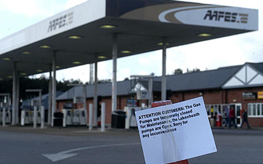A traffic cone with a warning sign on it tells customers that RAF Mildenhall&#39;s gas station is closed. The gas station had about 32,500 liters of fuel sucked out of one of its storage tanks Thursday after tests showed that its fuel was contaminated.