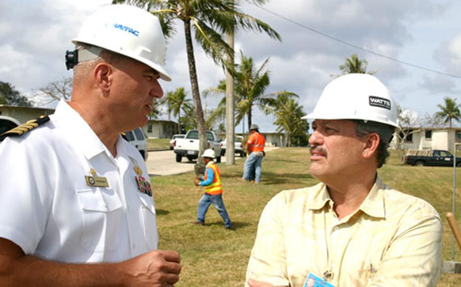 Capt. Kenneth Branch, left, commander of Naval Facilities Engineering Command Marianas, talks to Denny Watts, president and CEO of Watts Constructors, following the groundbreaking ceremony for phase I of the North Tipalao housing replacement project on Naval Base Guam in February.