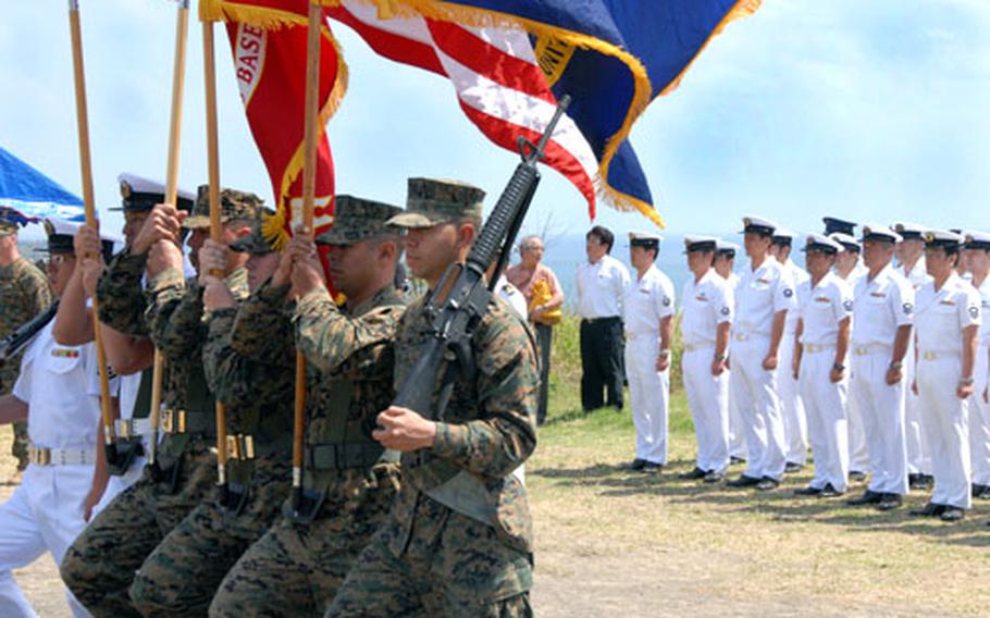 Marines present the colors at the ceremony Wednesday, along with two Japanese sailors who were taught the moves the day before. One of the Japanese sailors said he didn&#39;t really want to participate until he realized how precious the color guard is to the Marines.