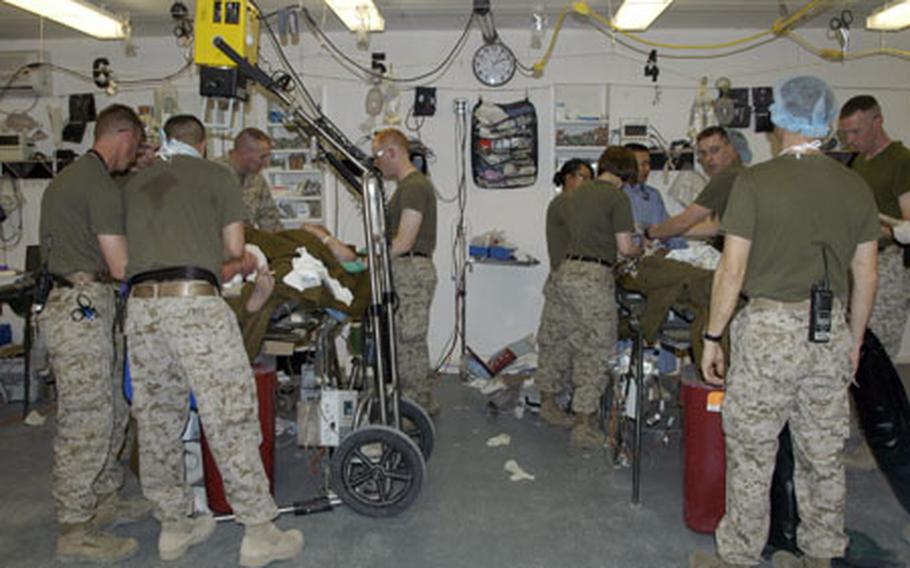 On the left, medical personnel from TQ Surgical work to stabilize a U.S. Marine who was shot in the leg. On the right, medics stabilize a young Iraqi boy who was crushed when the car he was traveling in rolled over in an accident.