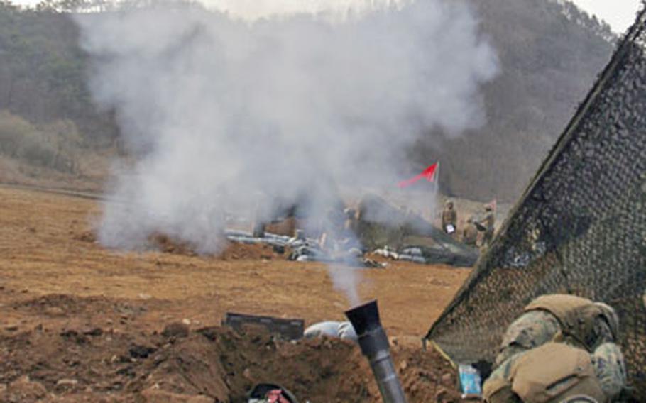 An 81mm mortar launches a projectile during a combined-arms live-fire exercise Friday at the Rodriguez Live Fire Complex in South Korea.