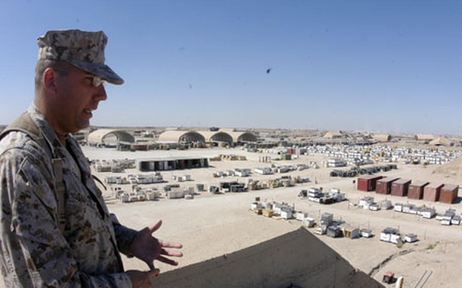 Chief Warrant Officer 2 John "Mojo" Simpson, operations officer with Supply Company, 2nd Maintenance Battalion, 2nd Marine Logistics Group (Forward), explains that supplies for all forces serving in western Iraq are stored at the Corps’ logistical hub at Camp Taqaddum.