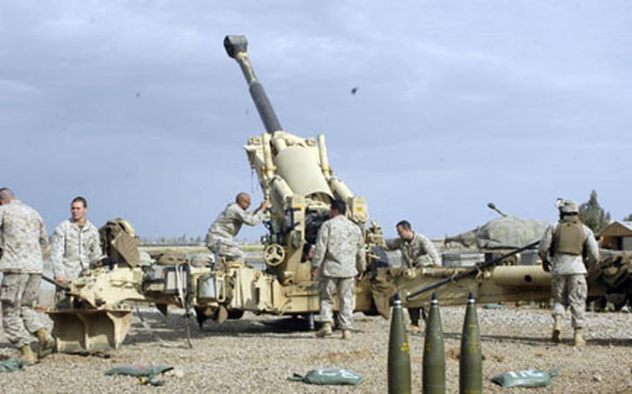 After getting a fire mission call, Marines with 2nd Platoon, India Battery, 3rd Battalion, 12th Marines reposition a Howitzer at Camp Fallujah on Tuesday morning to coordinates dictated by the fire direction center. The call for artillery was called off moments later.