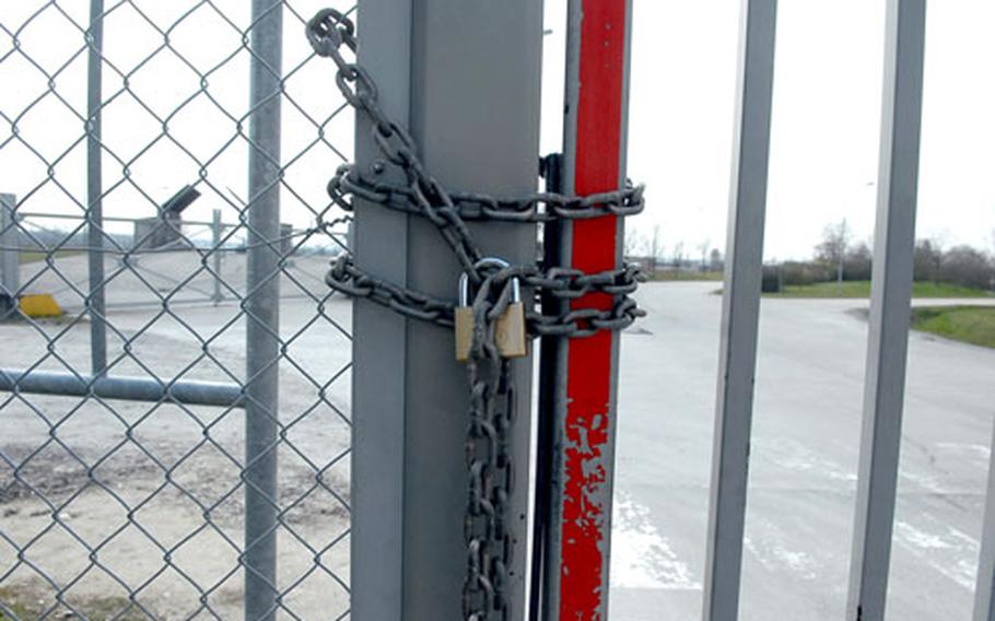 The gate to Harvey Barracks in Kitzingen, Germany, is chained and padlocked shut after the American military officially turned the post over to the local government on Thursday.
