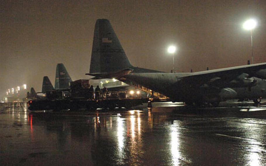 Alaskan Guard members load a C-130 headed to Bulgaria in support of Thracian Spring 07. About 200 Ramstein, Germany-based airmen are finishing up the exercise Friday.