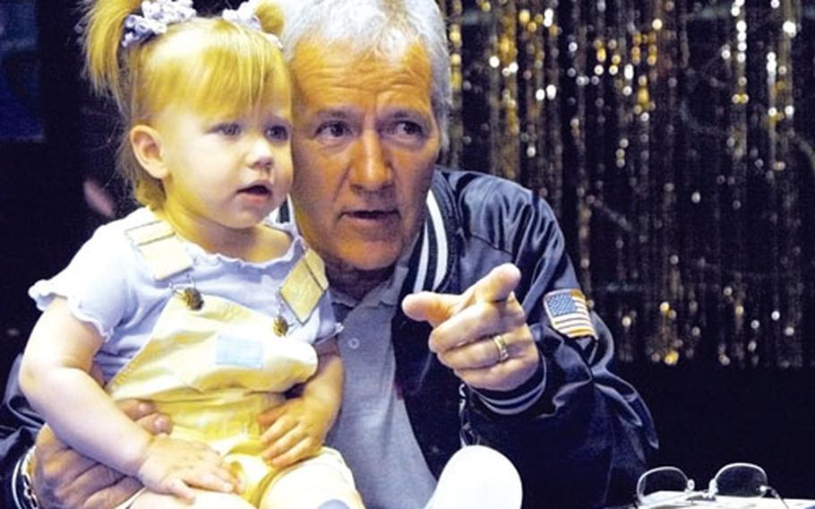 Little Sydney McDonald may only be 22 months old, but she already knows the Jeopardy! theme song. She recognized Jeopardy! host Alex Trebek Thursday when he came to Yokosuka Naval Base to scout contestants and to meet military members and their families.