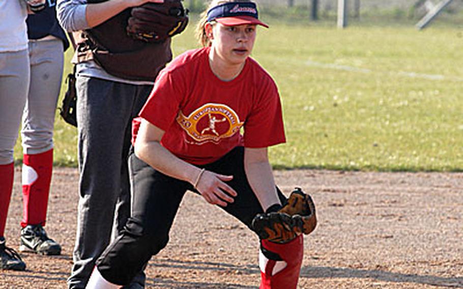 Lakenheath Lancers second baseman Maggie Pforts, foreground, braces for a ground ball in a recent practice before the team&#39;s first game against Stuttgart, Germany.