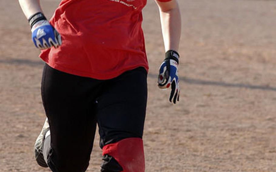 Maggie Pforts runs for third base in a recent practice at the Lakenheath High School softball field.