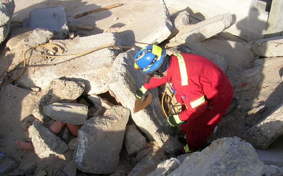 Firefighters with Iraq’s civil defense practice "rescuing" a mannequin as part of their training in Basra last December.