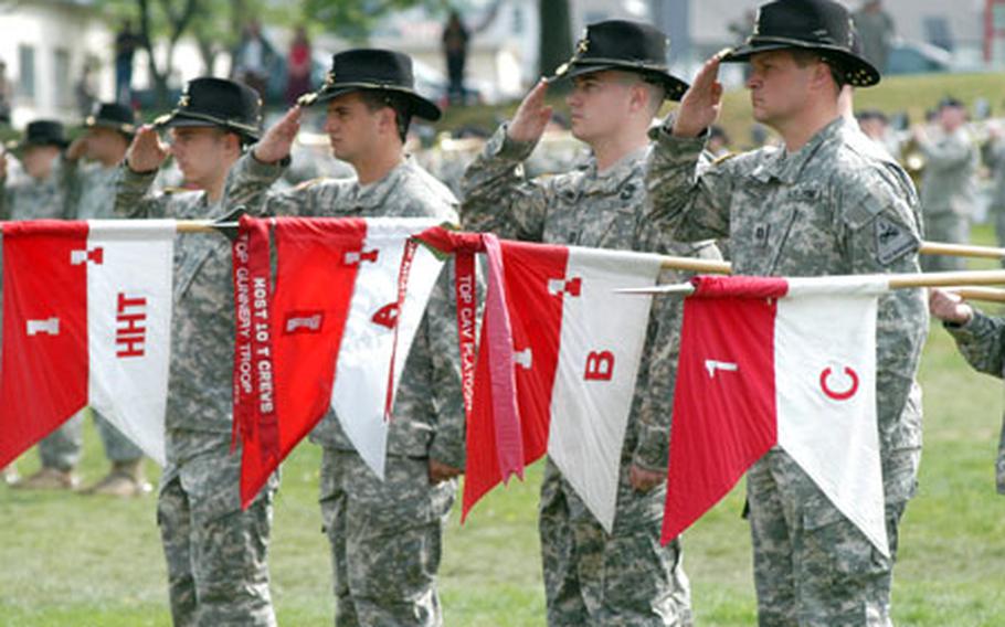 From left, Capt. Jon Kluck, Headquarters and Headquarters Troop; Capt. Nick Schenck, Troop A; Capt. Steve Johnson, Troop B; and Capt. Brian Guenthenspberger, Troop C of the 1st Squadron, 1st Cavalry Regiment, salute during their unit&#39;s inactivation ceremony.