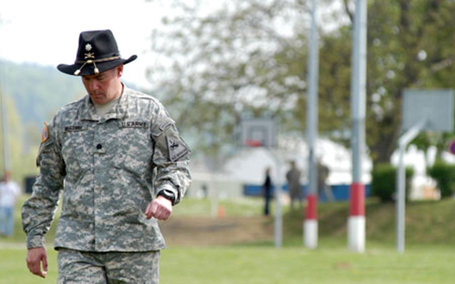 Lt. Col. Matthew McKenna, commander of the 1st Squadron, 1st Cavalry Regiment, walks across the parade field to participate in the flag casing at his unit&#39;s inactivation ceremnoy.