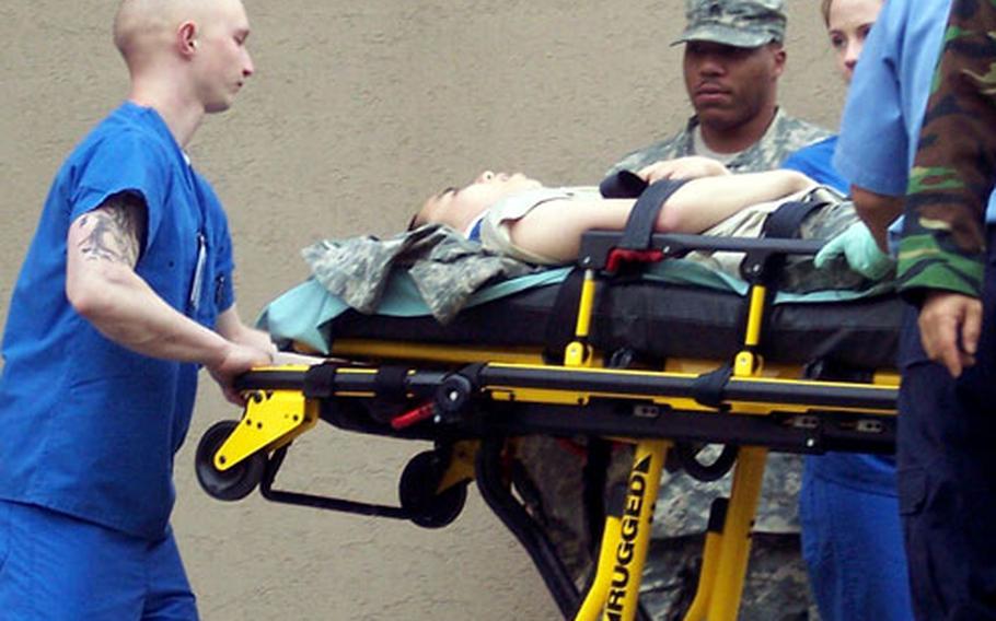 Medical personnel take the South Korean soldier to the 121st Combat Support Hospital, where he was treated and released the same day.