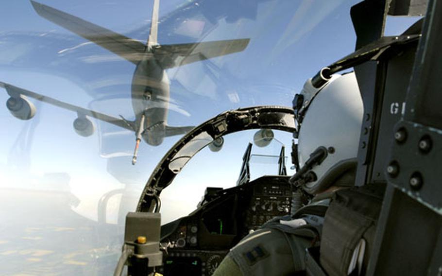 Capt. Brad "Rainman" Hurbinger, an F-15 “Eagle” pilot assigned to the 493rd Fighter Squadron, moves into position to receive fuel from a KC-135 “Stratotanker” TDY from RAF Mildenhall’s 351st Air Refueling Squadron during a training mission last week over Eastern Romania.