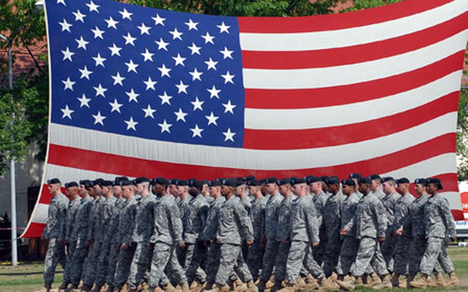 Soldiers of the 22nd Signal Brigade&#39;s 440th Signal Battalion march off the Kelley Barracks, Darmstadt, parade field at the conclusion of the ceremony inactivating the 22nd Signal Brigade and the 440th and 32nd Signal Battalions.