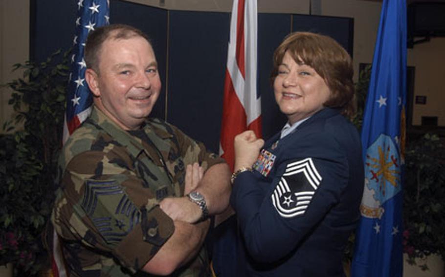 Chief Master Sgts. Douglas and Cynthia Ream show off their chief stripes following Cynthia&#39;s promotion ceremony last week. The couple also work in the maintenance career field.