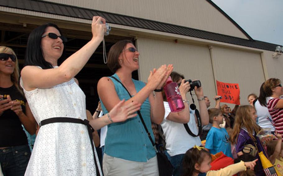 Scores of families, friends and co-workers greeted Misawa Air Base’s 300 returning airmen Saturday morning outside Hangar 949. The airmen were deployed to Balad Air Base, Iraq, for nearly five months.