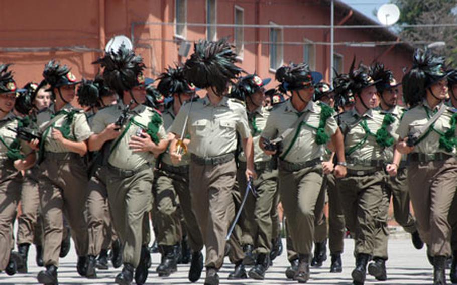 Italy’s Bersaglieri Brigade soldiers run in formation.