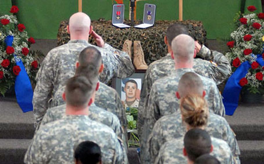 Soldiers pay their last respects to Staff Sgt. Michael Bechert, 1st Battalion, 18th Infantry Regiment, 2nd Brigade Combat Team, 1st Infantry Division, at the Ledward Barracks chapel in Schweinfurt, Germany, on Monday.