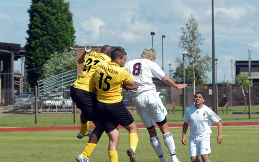 Mildenhall&#39;s Brian Liston-Clark (8) goes up for a header against two Ramstein players in the men&#39;s final.