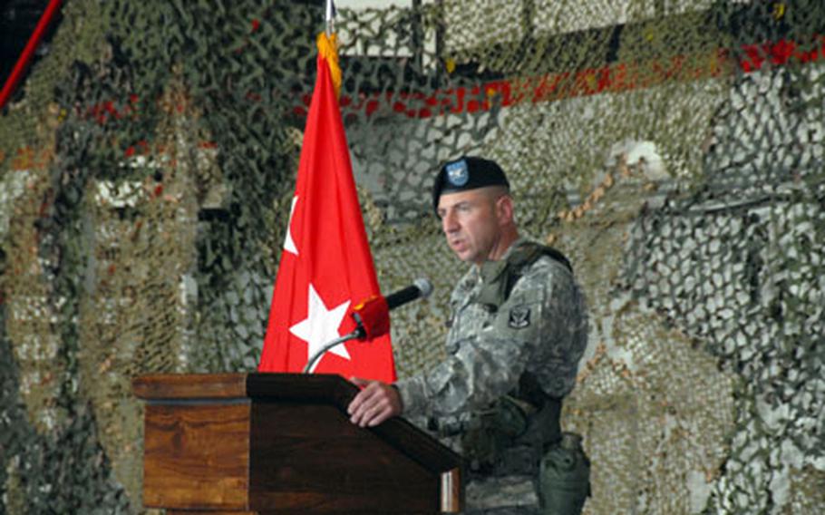 Col. John Rossi, outgoing commander of the 35th Air Defense Artillery Brigade, speaks Tuesday during a change of command ceremony at Osan Air Base. He is being replaced by Col. James Dickinson.