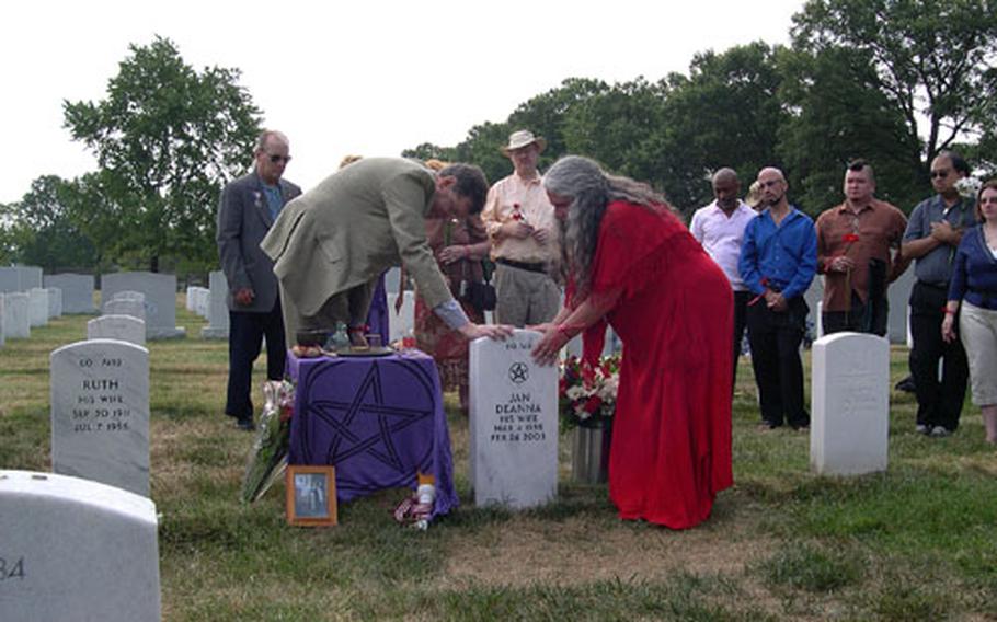 Rev. Barry Lynn (left) of Americans United for Separation of Church and State and Rev. Selena Fox of Circle Sanctuary in Wisconsin deliver a blessing over the grave site of Jan Deanna O’Rourke on July 4.
