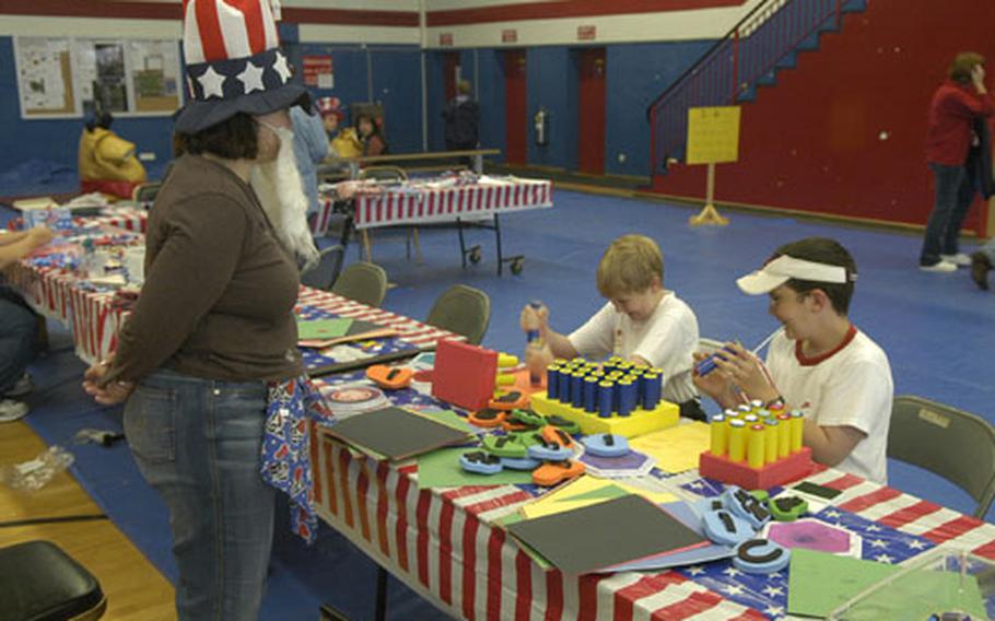Inside, away from the rain, children painted pictures and learned about various arts and crafts during Independence Day festivities in Baumholder.