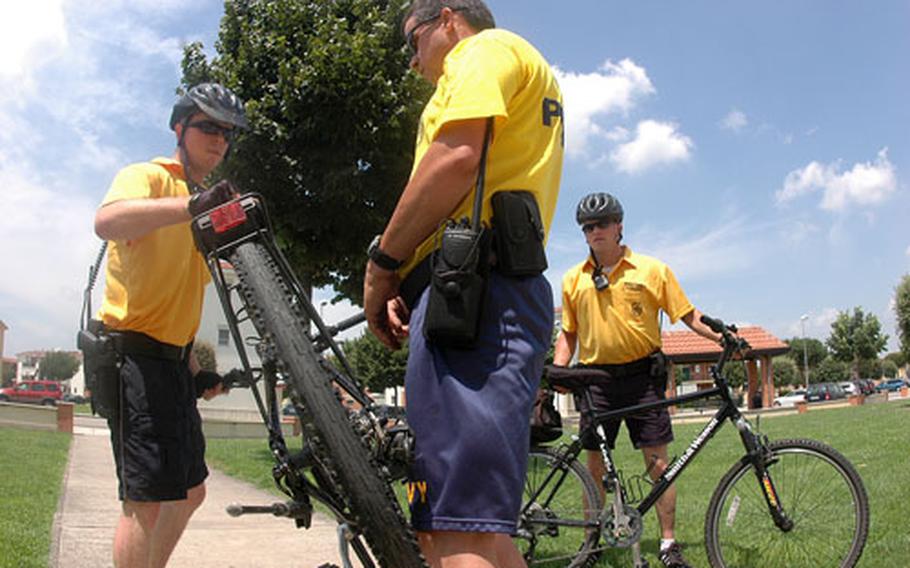 Petty Officer 3rd Class Dustin Kling, 24, practices using his bike as a barricade between himself and his instructor, New York police officer and Reservist Petty Officer 1st Class John McCoy, while Petty Officer 2nd Class Russell Nyland looks on.