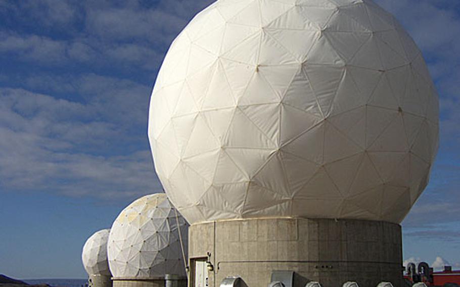 The three "radomes" at Thule Air Base in northern Greenland house the powerful satellite dishes of Detachment 3 of the 22nd Space Operations Squadron in a low valley hundreds of miles north of the Arctic Circle.