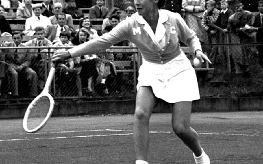 Maureen Connolly returns a shot during the 1954 Wiesbaden International tennis tournament.