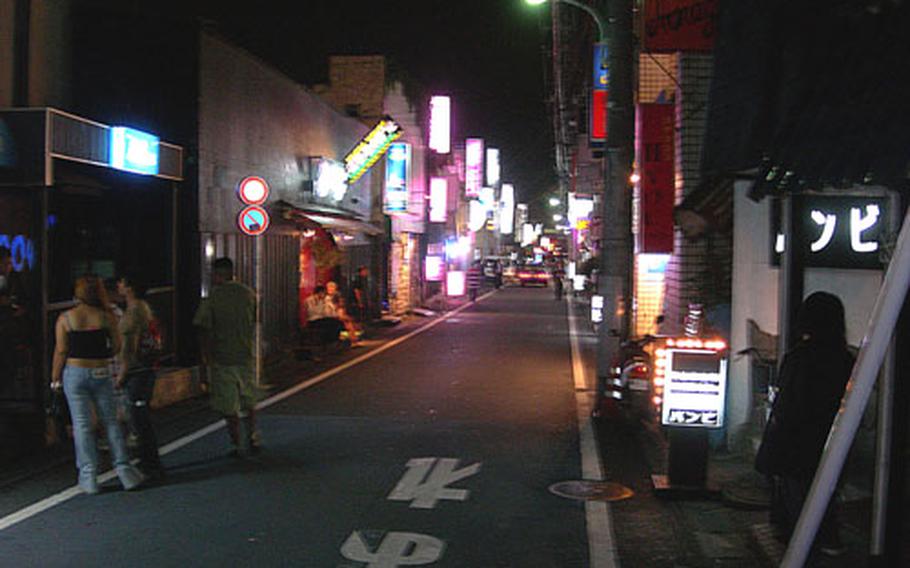 While base officials say the number of incidents involving Yokota Air Base personnel in the "Bar Row" area (pictured here) has decreased since a 1 a.m. to 6 a.m. restriction went into effect in May 2005, some local residents feel there still is a problem with noise and littering in the area.