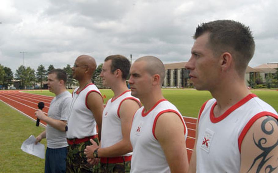 From right, Cpl. John McRae, 29, of Edinburgh; Cpl. Mark Dowland, 24, of St. Ives, Cornwall; Cpl. Ian Hopkins, 24, of Colchester, Essex and Lance Cpl. Stephen Grant, 47, of Ipswich, Suffolk stand alongside 48th Communications Squadron Senior Airman Brent Beadle before the start of the Commander&#39;s Cup challenge on RAF Lakenheath.