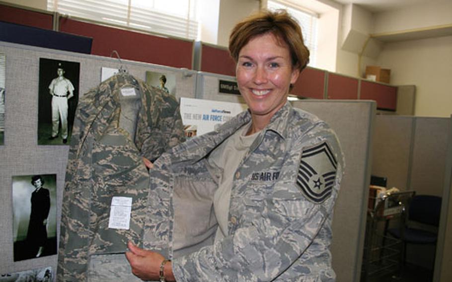 Senior Master Sgt. Dana Athnos, Air Force uniform board superintendent, shows the unpopular interior pocket of the Airman Battle Uniform, left, which adds two hot extra layers of material.