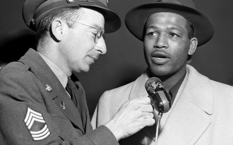 Sugar Ray Robinson is interviewed after arriving in Frankfurt.