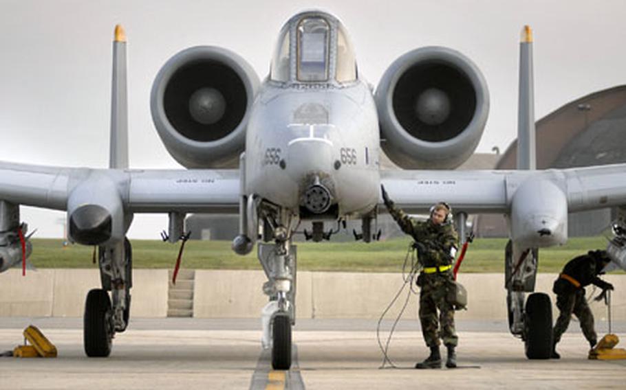 Crew chiefs remove chalks and a communication cord before launching a Spangdahlem A-10 Thunderbolt II for a local training mission last November. Investigators have determined that a Spangdahlem-based A-10 Thunderbolt pilot committed a "perception error” when he accidentally killed a Canadian soldier during a strafing run last September in Afghanistan.