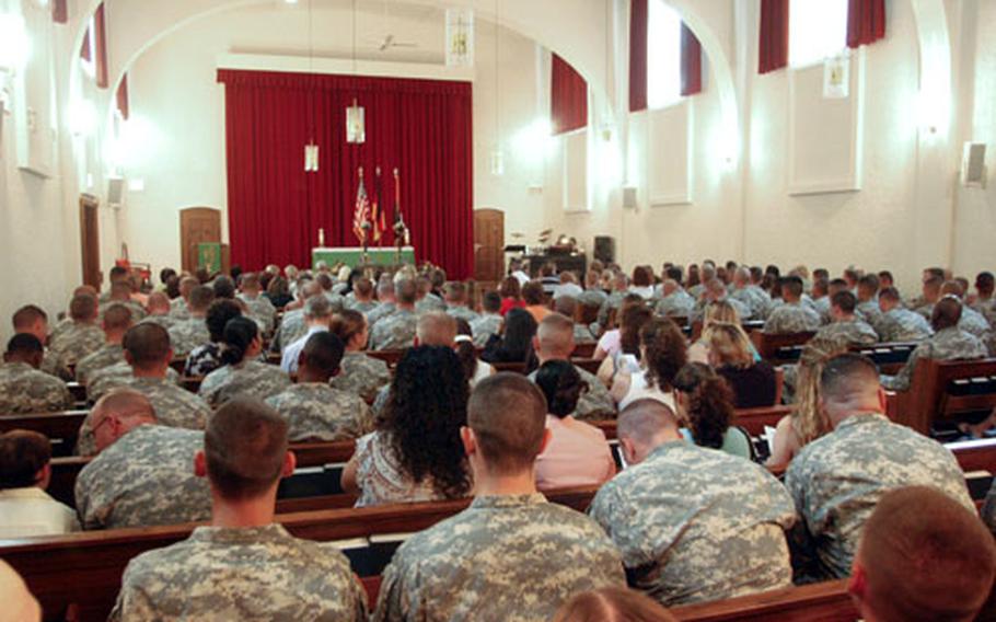 Soldiers pack the Ledward Chapel on Thursday to remember Sgt. 1st Class Raymond R. Buchan and Staff Sergeant Michael L. Ruoff Jr., killed in an ambush in Iraq.
