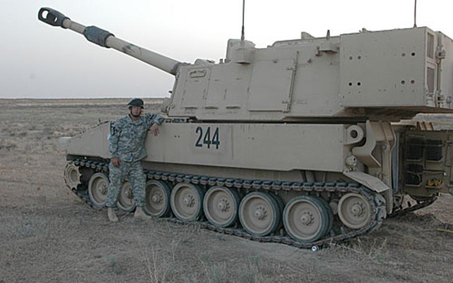Sgt. 1st Class Lea Masters. 43, of Chesapeake, W. Va., leans against a 155 mm Paladin howitzer at Forward Operating Base Q-West, Iraq. A former contestant of the TV show "Survivor," Masters is an artilleryman attached to the 5th Battalion, 82nd Field Artillery Regiment, 4th Brigade, 1st Cavalry Division.