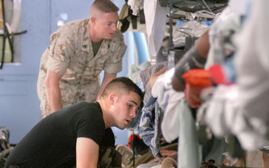 Cotter checks on a patient aboard a C-17 coming from Iraq to Ramstein Air Base in Germany on July 5.