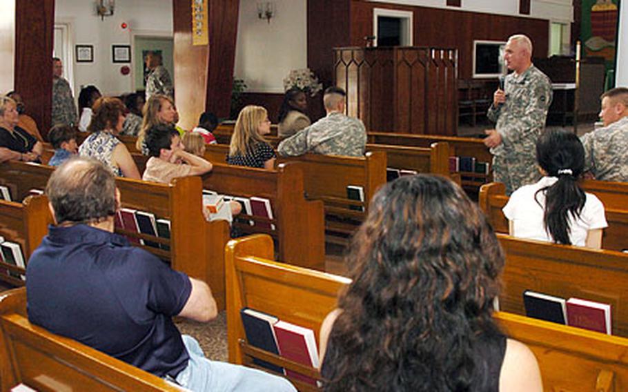 Col. Allen Blake Boatright, command chaplain for U.S. Army Japan, speaks to the congregation gathered in Camp Zama’s chapel Friday before a slideshow and ceremony celebrating the Chaplain Corps’ 232nd anniversary.