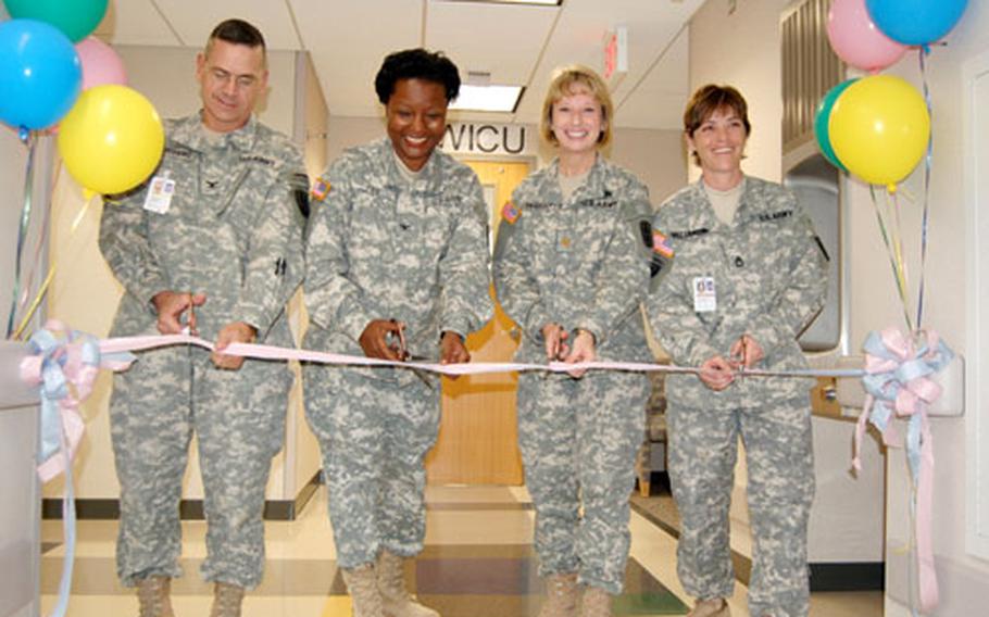 From left, Col. Gregory Jolissaint, commander 18th Medical Command; Col. Leana Fox, deputy commander of nursing; Maj. Liz Murray, Women and Infant Care Unit head nurse; and WICU noncommissioned officer in charge Sgt. 1st Class Tracie Williamson cut the ribbon for the 121st Combat Support Hospital’s new WICU Thursday at Yongsan Garrison.