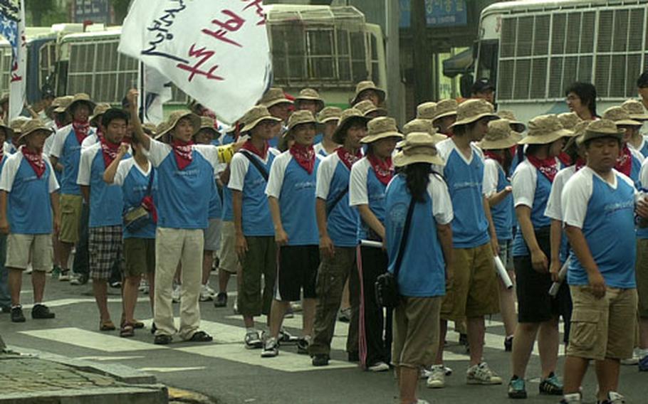 Protesters against U.S. forces’ presence in South Korea demonstrate at Bosan Station in Dongducheon, South Korea, about a quarter-mile from Camp Casey’s main gate, after a smaller group of pro-U.S. local merchants confronted them.