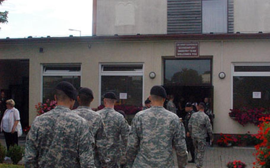 Soldiers file into Ledward Chapel on July 19 during a memorial service, one of many held there since the Schweinfurt, Germany-based 2nd Brigade, 1st Infantry Division deployed a year ago to Iraq.